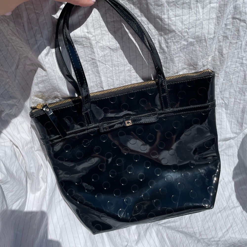 Patent black Authentic Kate Spade with dot pattern and tiny bow.